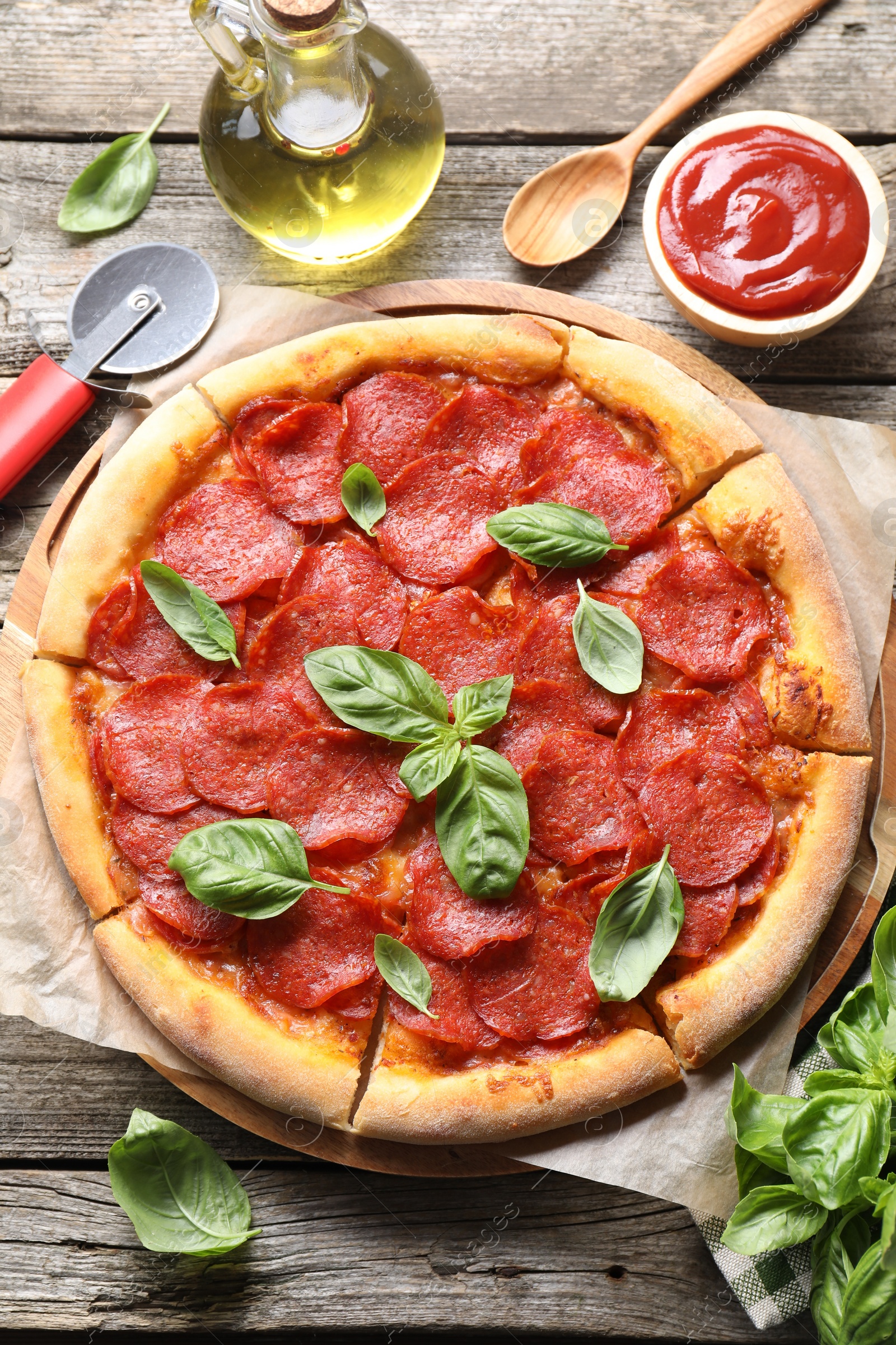 Photo of Flat lay composition with tasty pepperoni pizza on wooden table