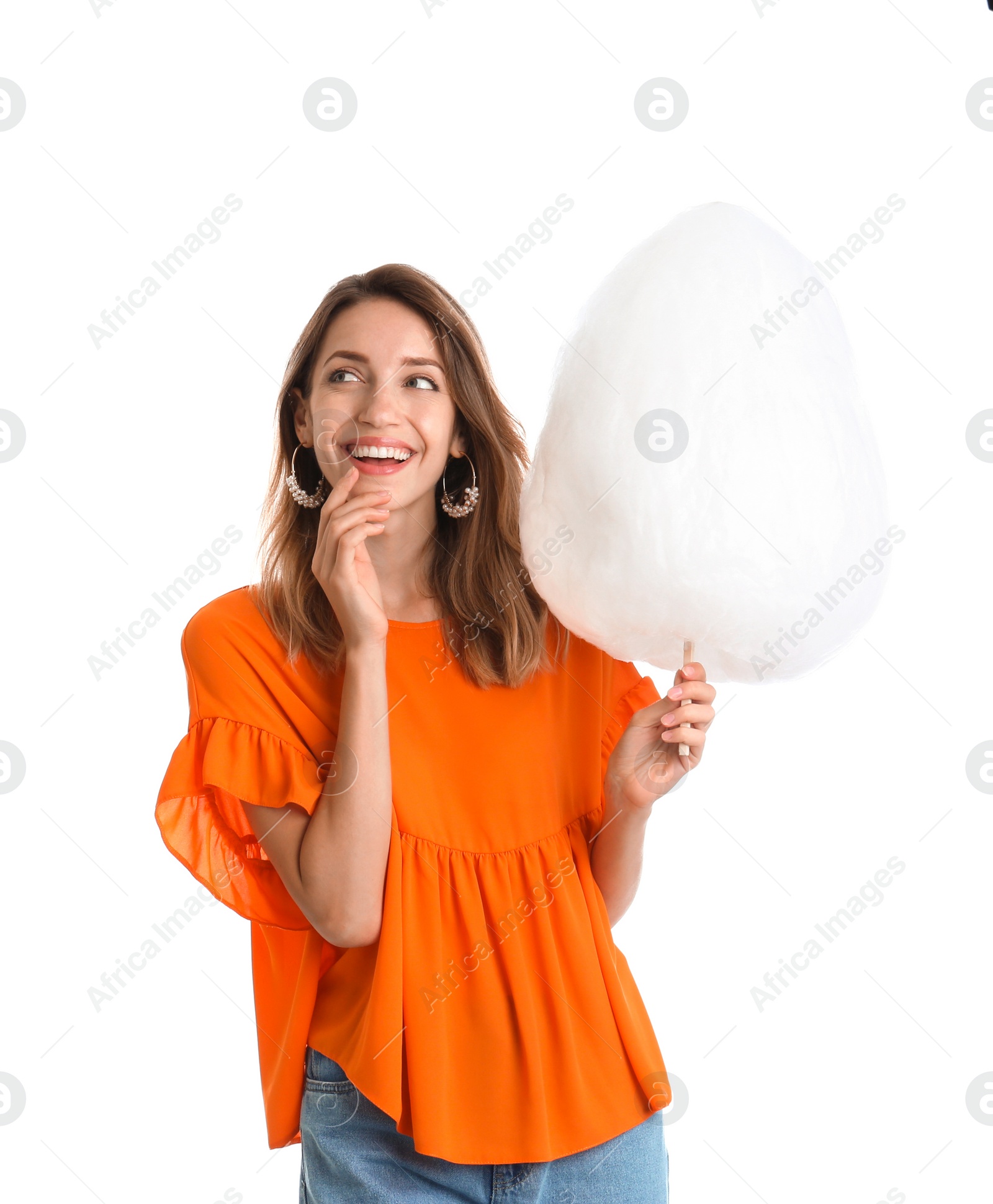 Photo of Happy young woman with cotton candy on white background