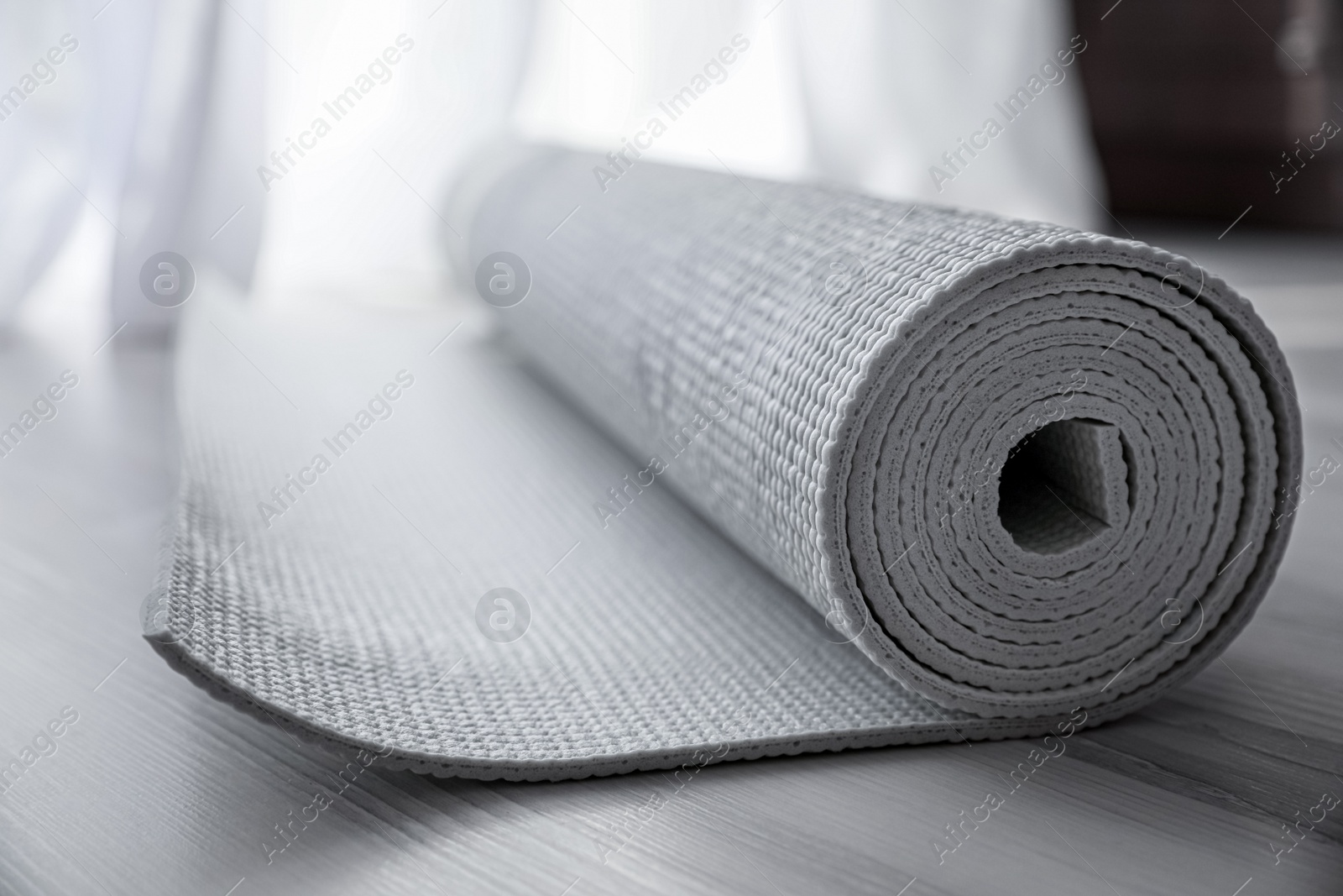 Photo of Karemat or fitness mat on floor, closeup
