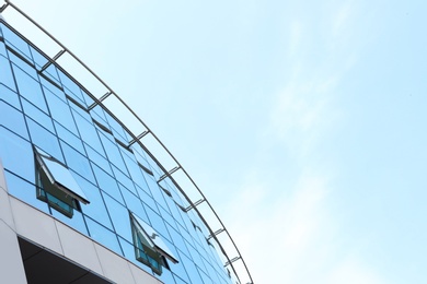 Photo of Building with tinted windows, outdoors. Modern architectural design