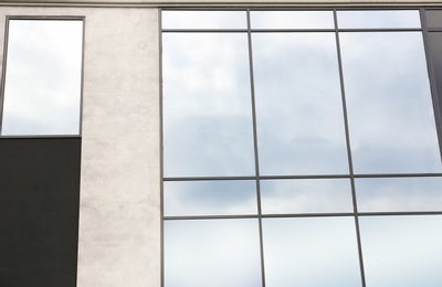 Modern office building with tinted windows. Urban architecture