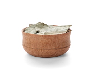 Photo of Small bowl with bay leaves on white background. Different spices for cooking