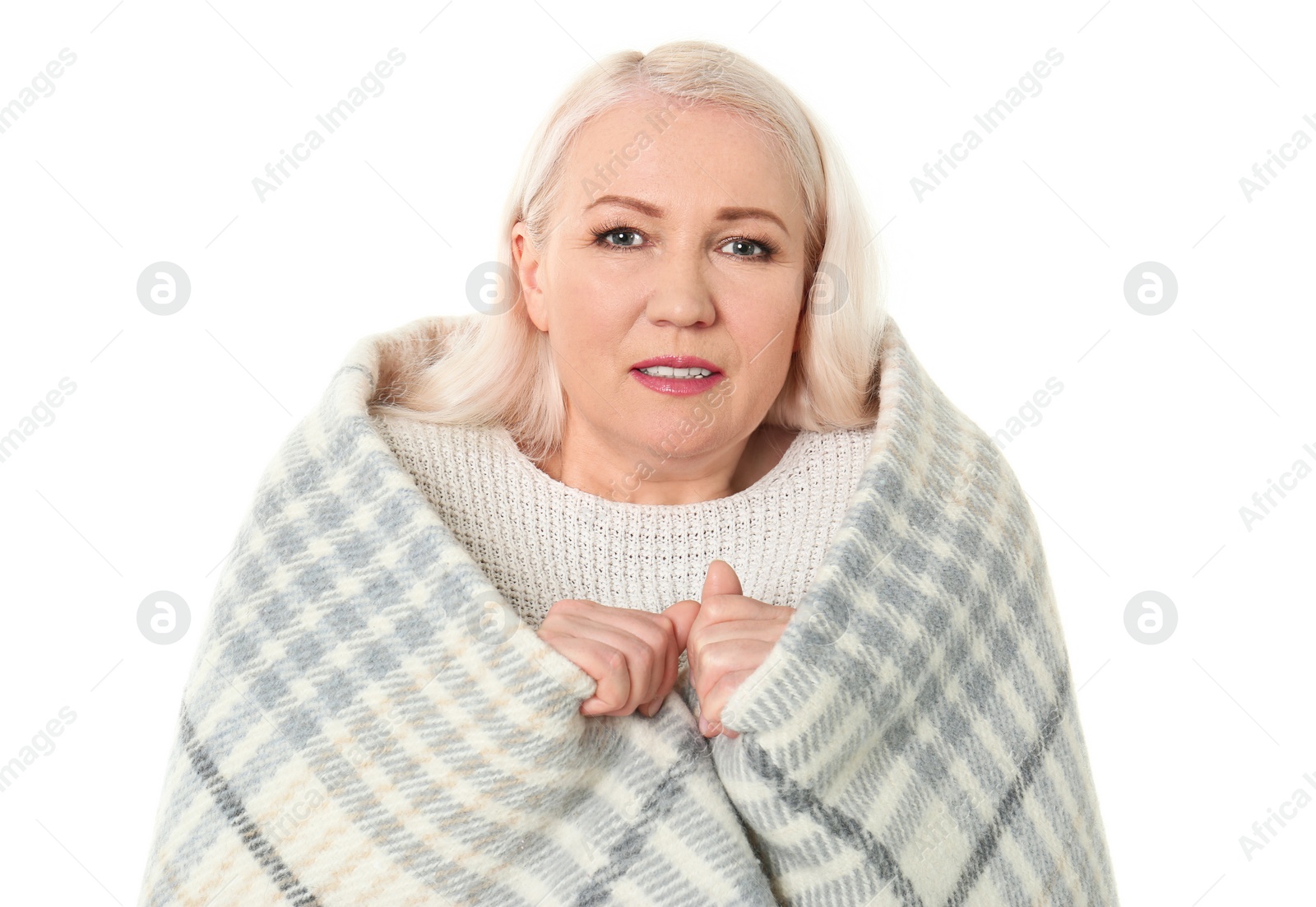 Photo of Mature woman wrapped in blanket  suffering from cold on white background