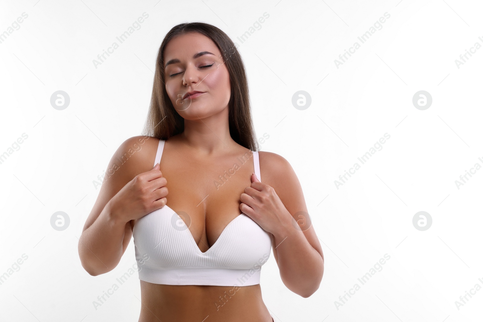 Photo of Portrait of young woman with beautiful breast on white background. Space for text