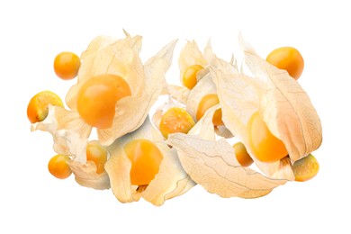 Image of Ripe orange physalis fruits with calyx falling on white background