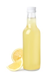 Photo of Delicious kombucha in glass bottle and lemon isolated on white