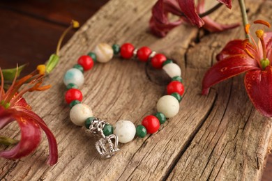 Stylish presentation of beautiful bracelet with gemstones on table, closeup
