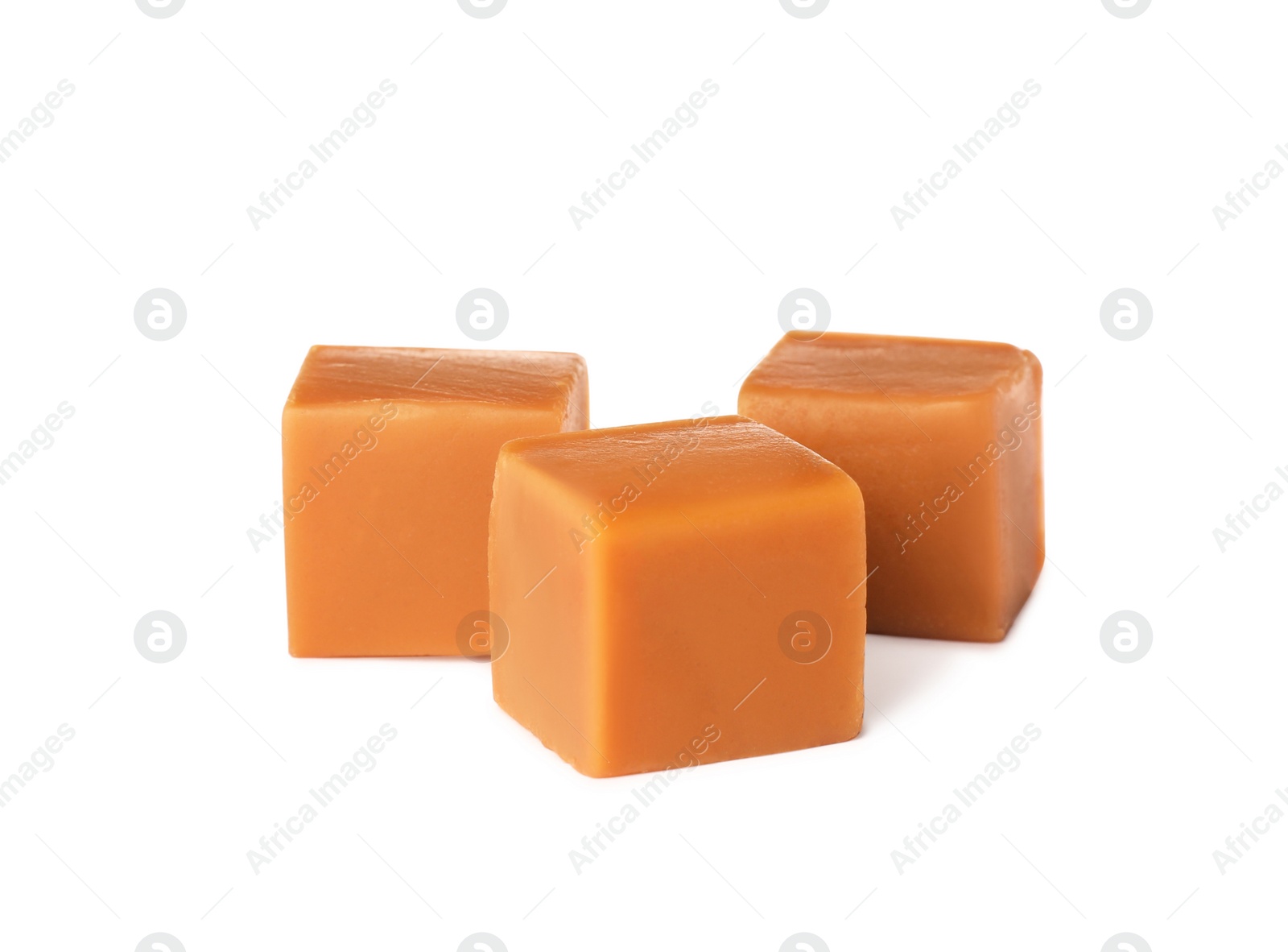 Photo of Heap of caramel candies on white background