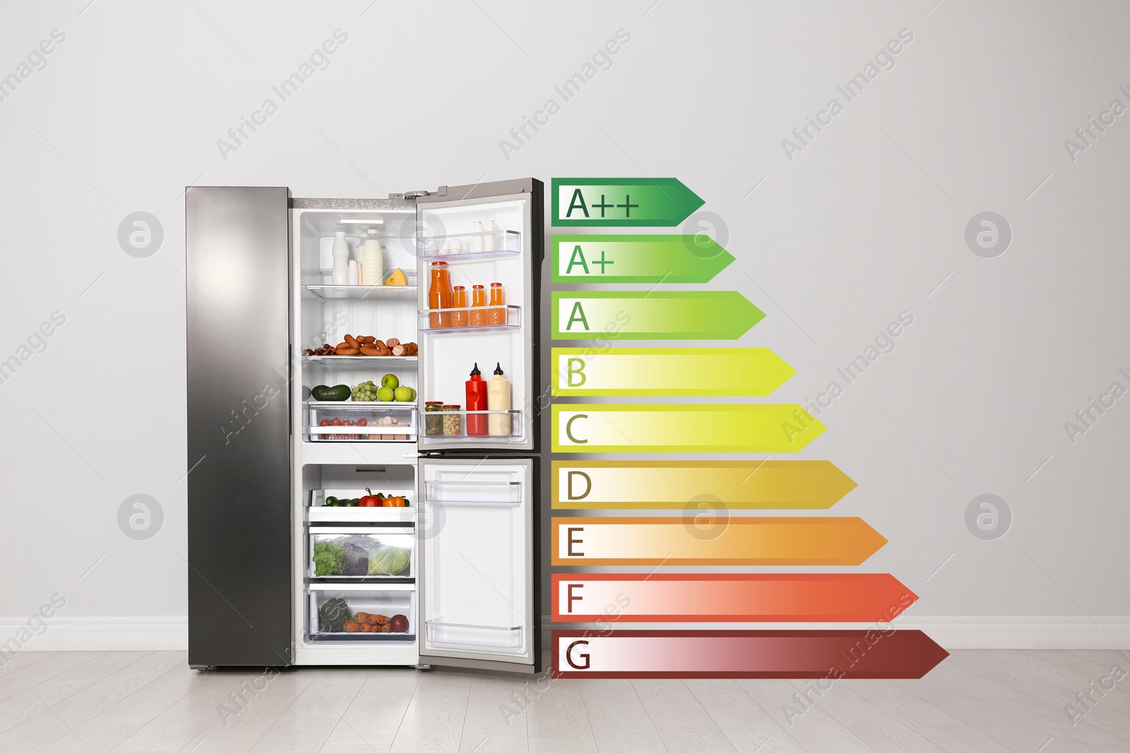 Image of Energy efficiency rating label and open refrigerator near light wall indoors