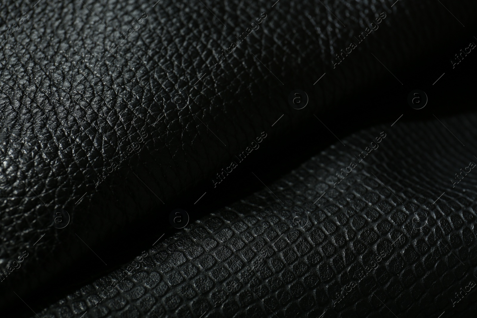 Photo of Black natural leather as background, closeup view