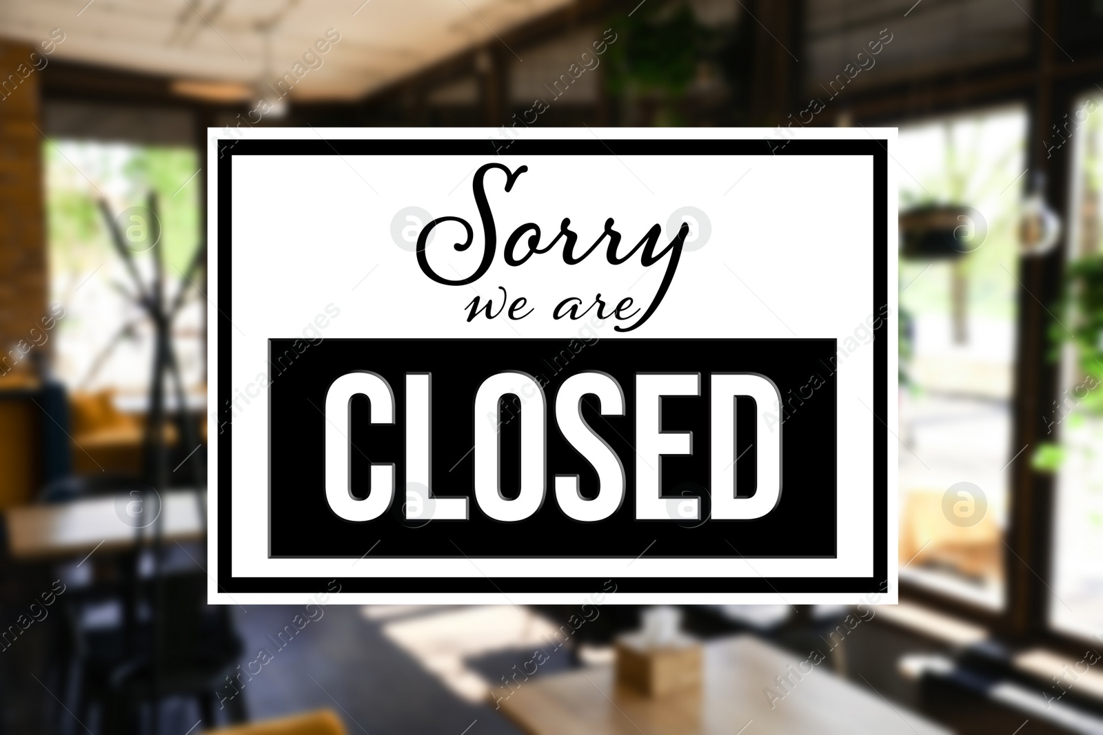 Image of Sorry we are closed sign against blurred background