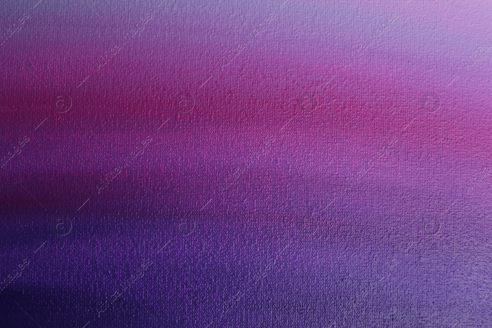 Photo of Canvas with colorful gradient painting, closeup view