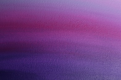 Photo of Canvas with colorful gradient painting, closeup view