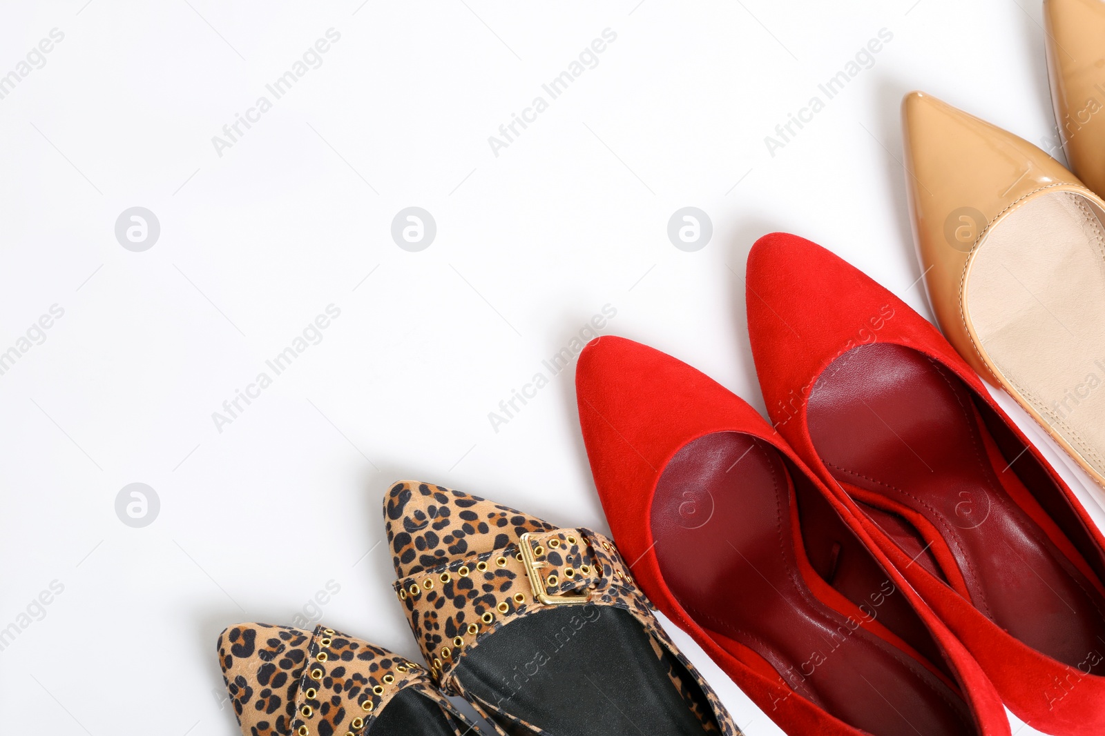 Photo of Different shoes on white background, top view