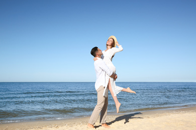 Lovely couple having fun on sea beach