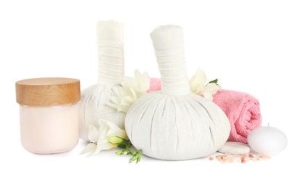 Photo of Herbal massage bags and other spa products on white background