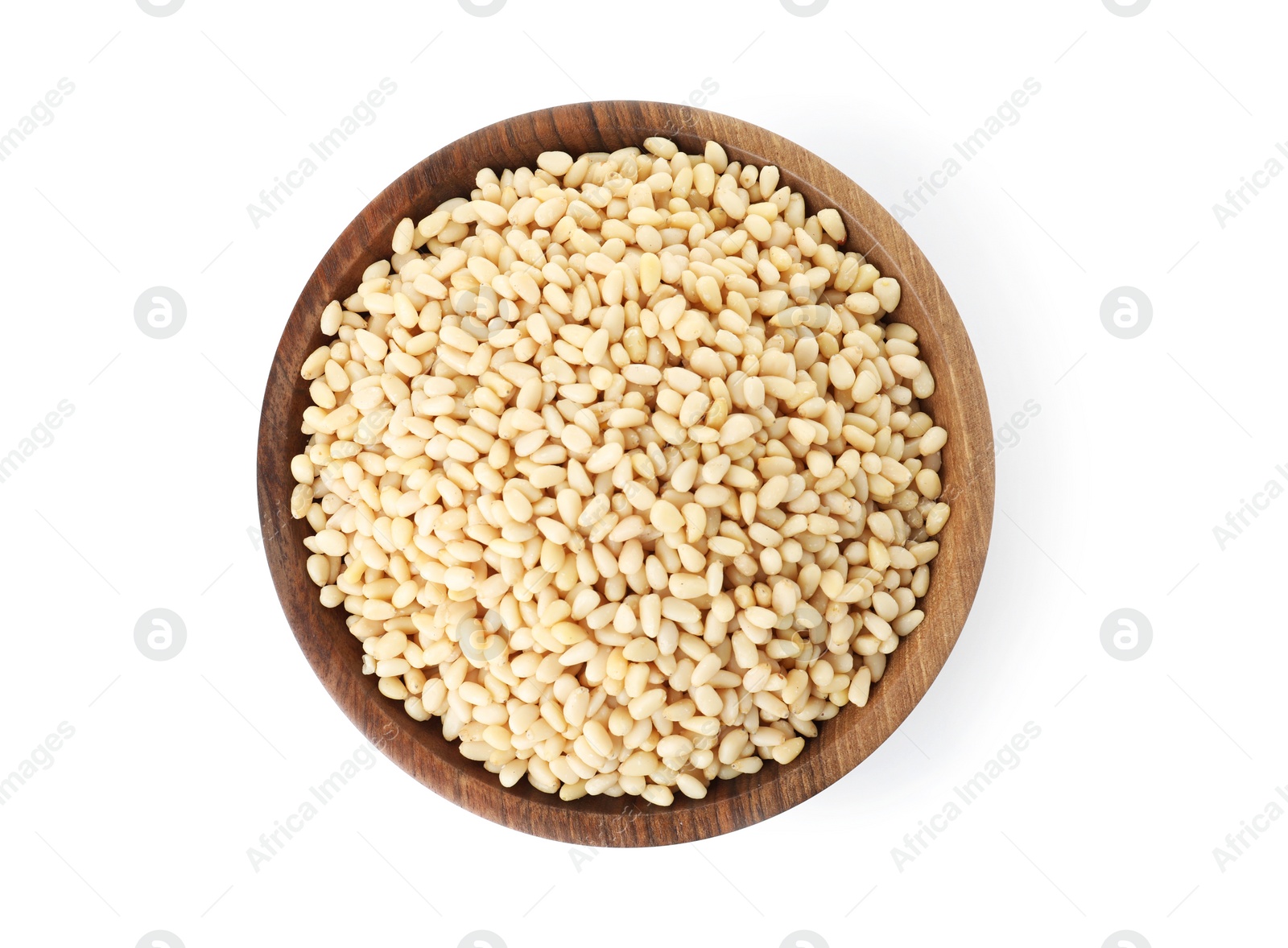 Photo of Plate with pine nuts on white background, top view