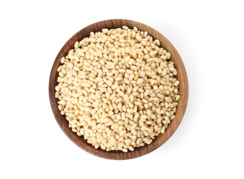 Plate with pine nuts on white background, top view