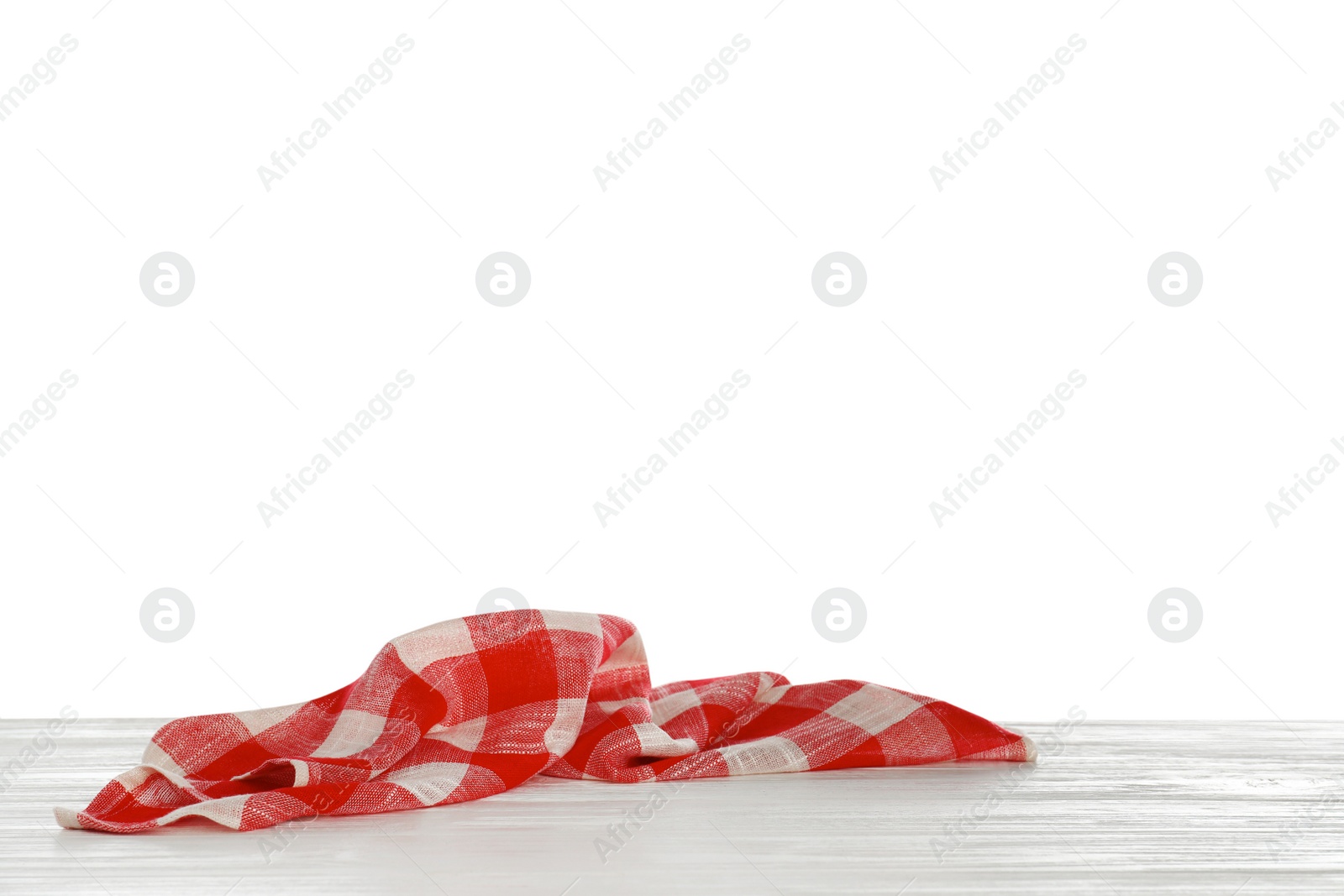 Photo of Crumpled napkin on table against white background