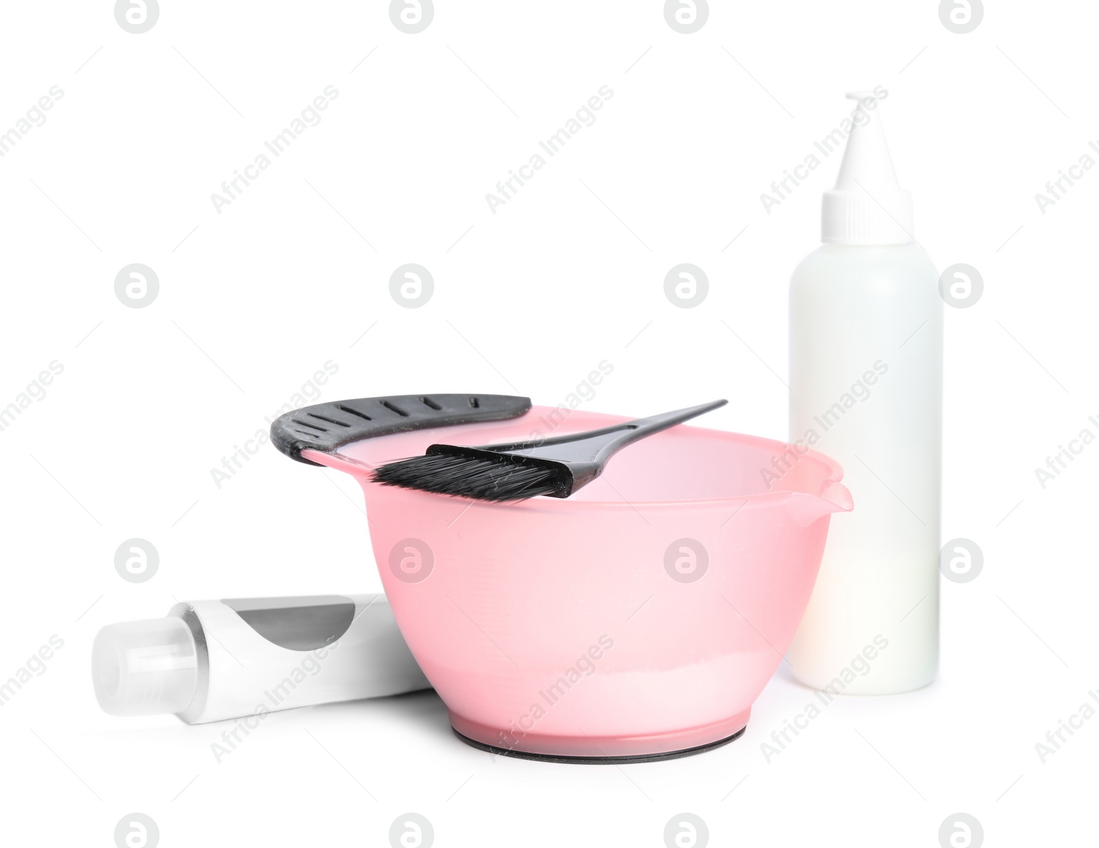 Photo of Professional tools for hair dyeing on white background