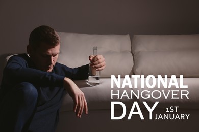 Image of National hangover day - January 1st. Man with alcoholic drink near sofa indoors