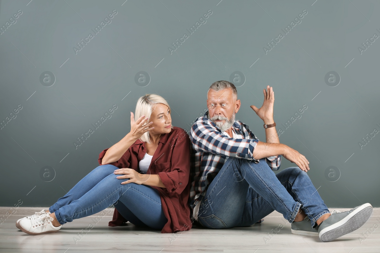 Photo of Mature couple having argument indoors. Relationship problems