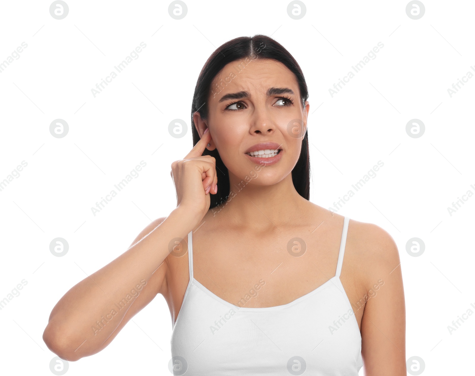 Photo of Young woman suffering from ear pain on white background