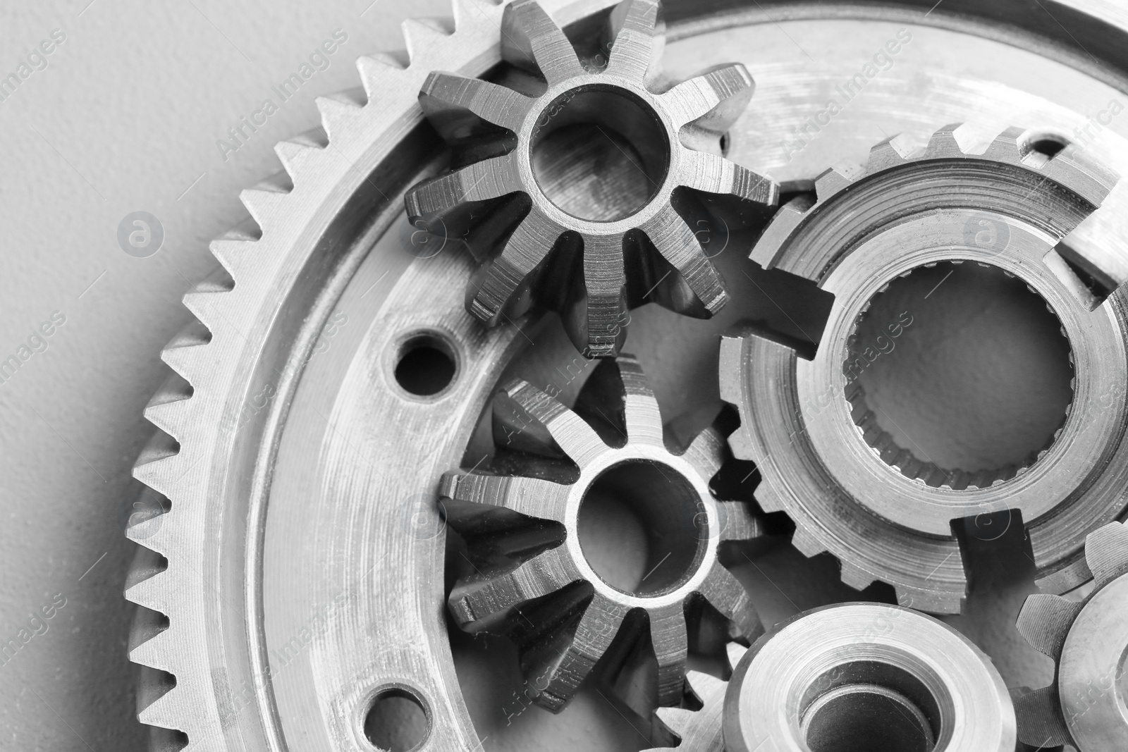 Photo of Different stainless steel gears on light grey background, top view