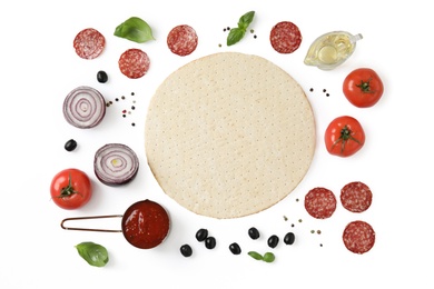 Flat lay composition with base and ingredients for pizza on white background