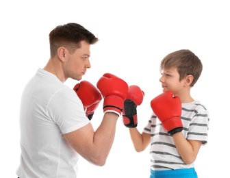 Photo of Dad and his son with boxing gloves on white background
