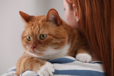 Woman with her cute cat, closeup view