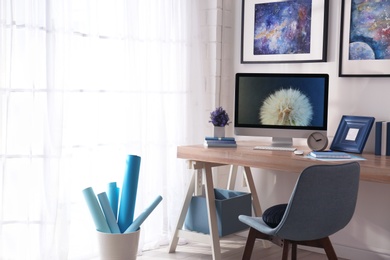 Modern workplace interior with computer on table