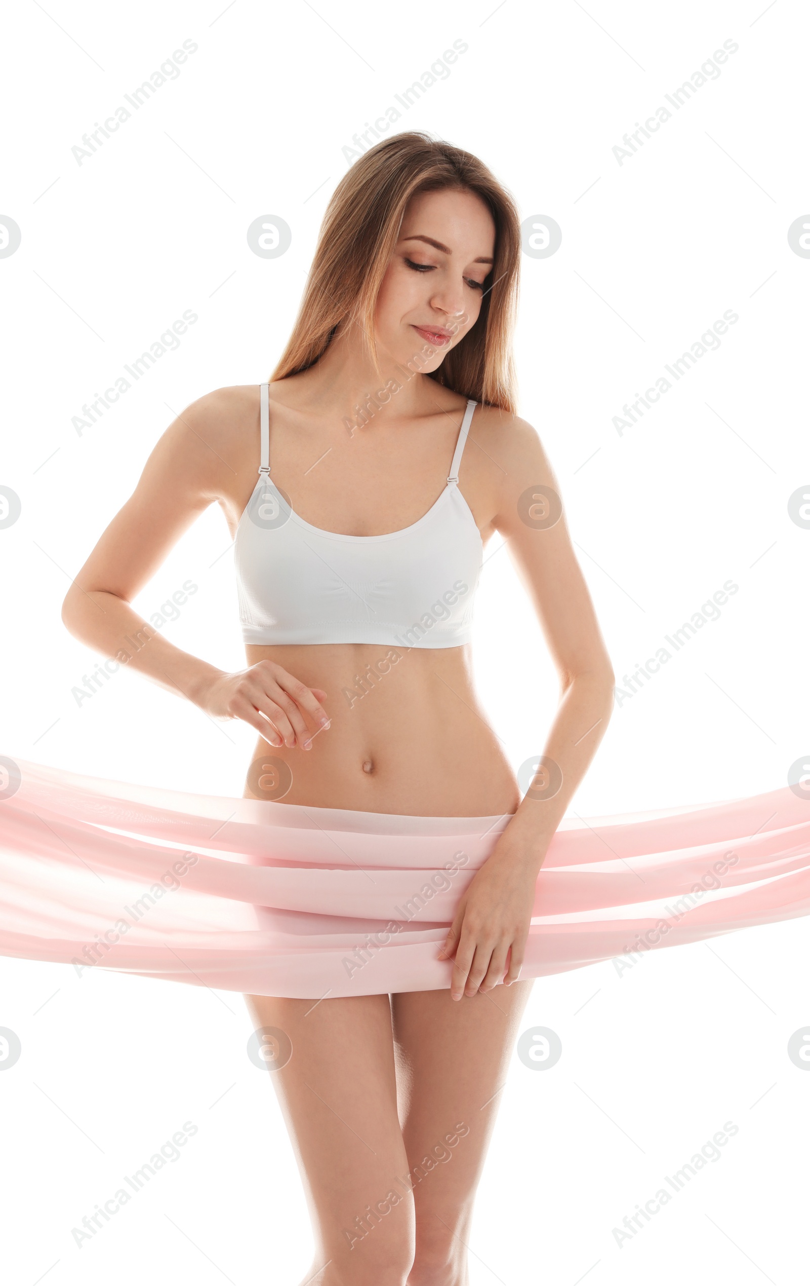 Photo of Young slim woman covering her body with fabric on white background