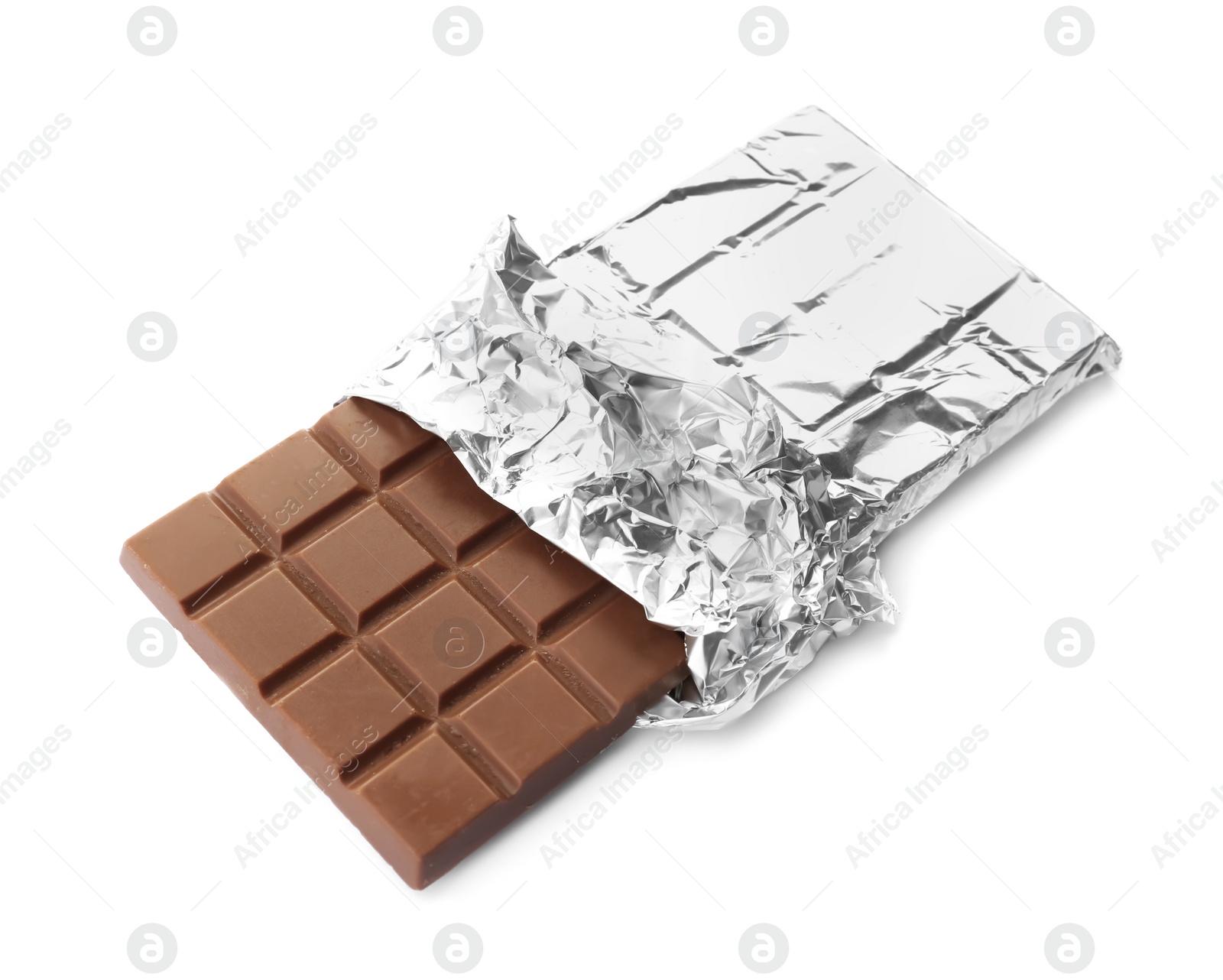 Photo of Delicious milk chocolate bar in foil on white background