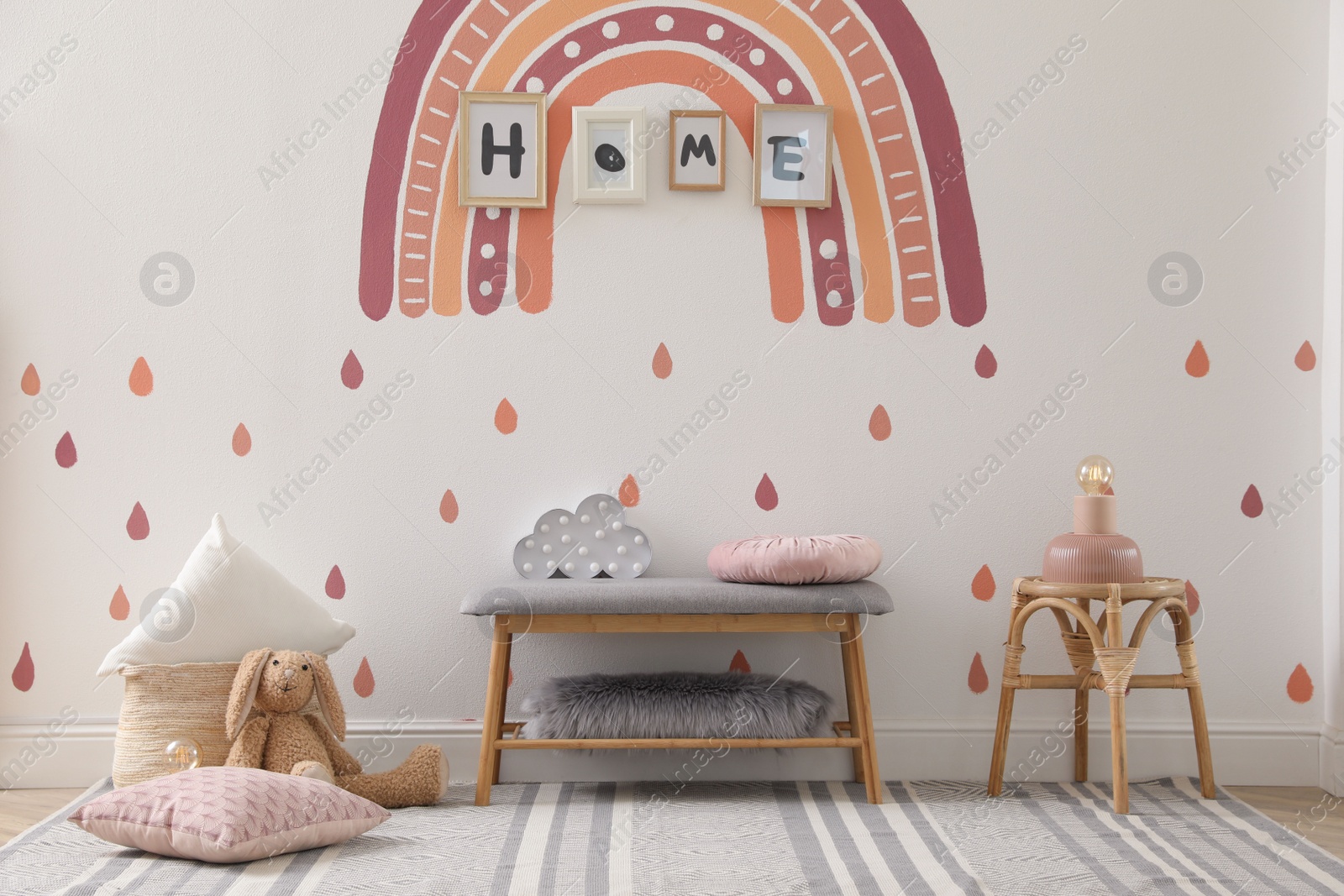 Photo of Child's room interior with rainbow painting on wall