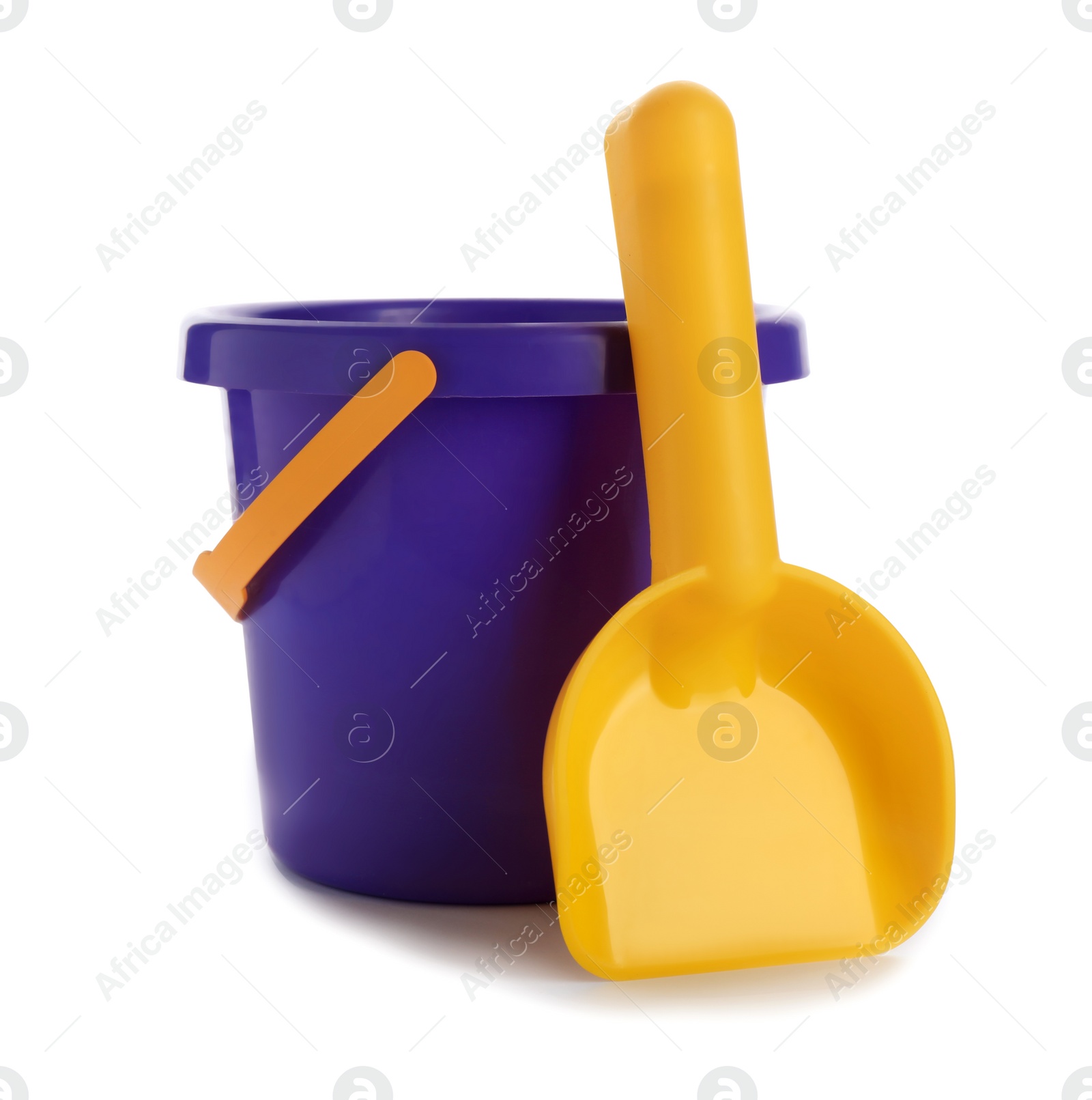 Photo of Toy bucket for sand and shovel on white background