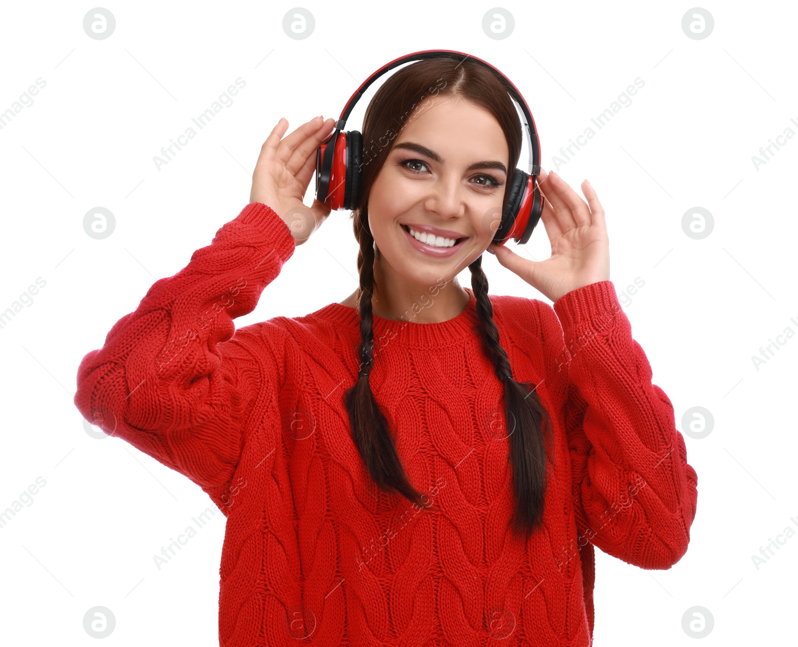 Photo of Young woman listening to music with headphones on white background