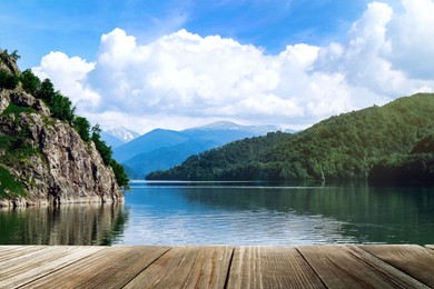 Beautiful view of mountains and wooden pier near river on sunny day