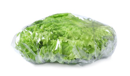 Photo of Fresh lettuce wrapped with transparent plastic stretch film isolated on white