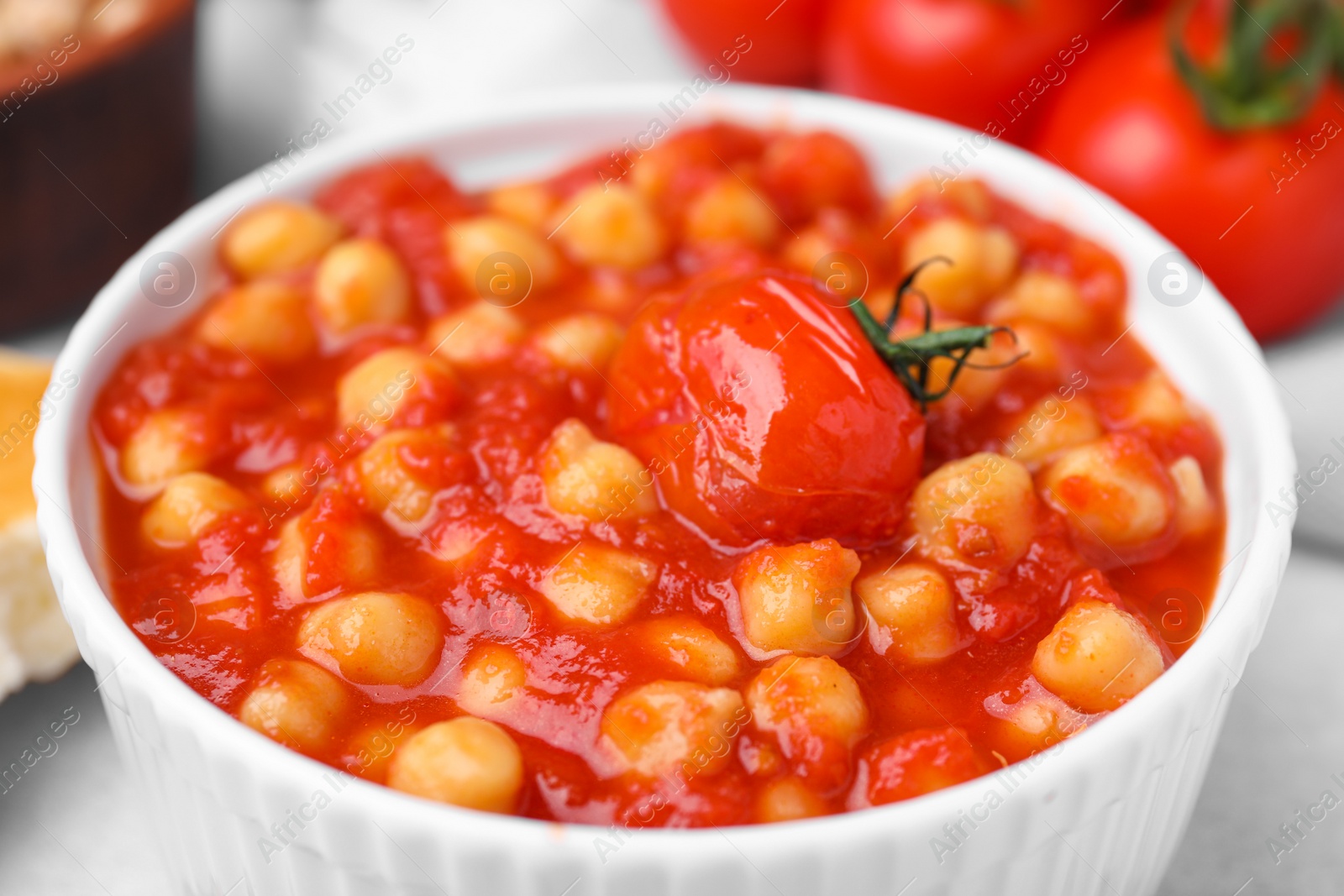 Photo of Delicious chickpea curry in bowl on table, closeup