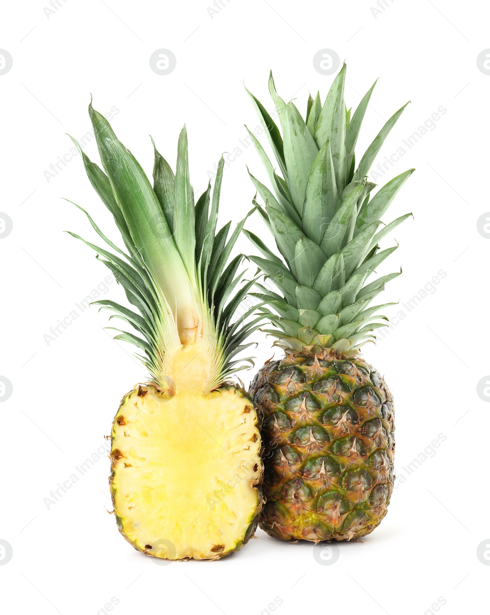 Photo of Whole and cut juicy pineapples isolated on white