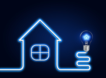 Image of Creative image of house and light bulb on dark background. Energy efficiency, loan, property or business idea concepts
