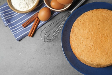 Photo of Flat lay composition with delicious fresh homemade cake on grey marble table