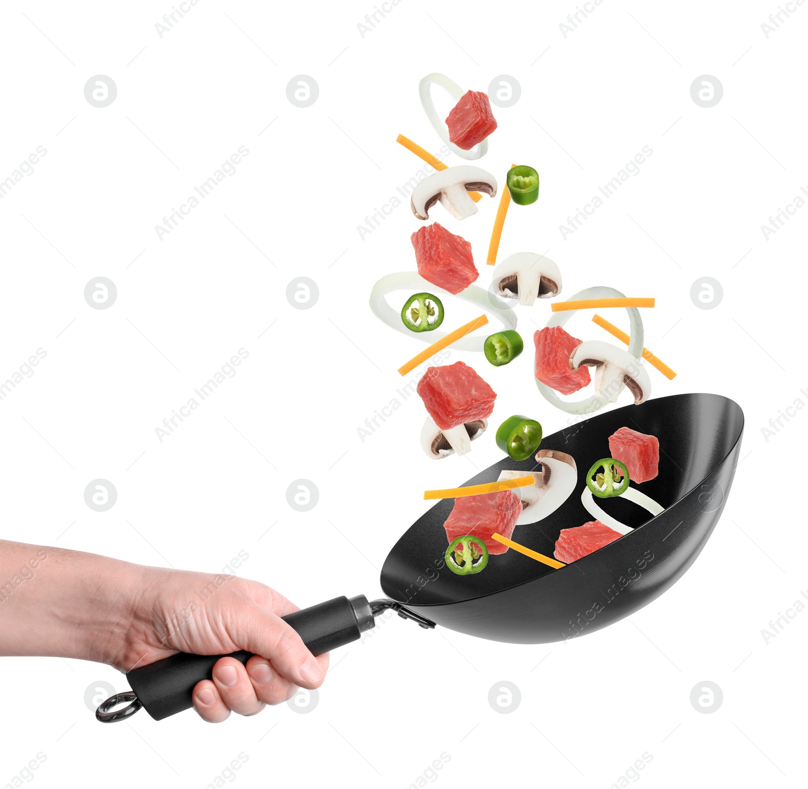 Image of Man tossing ingredients in wok on white background, closeup