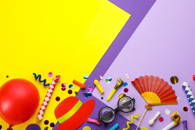 Photo of Flat lay composition with carnival items on color background. Space for text