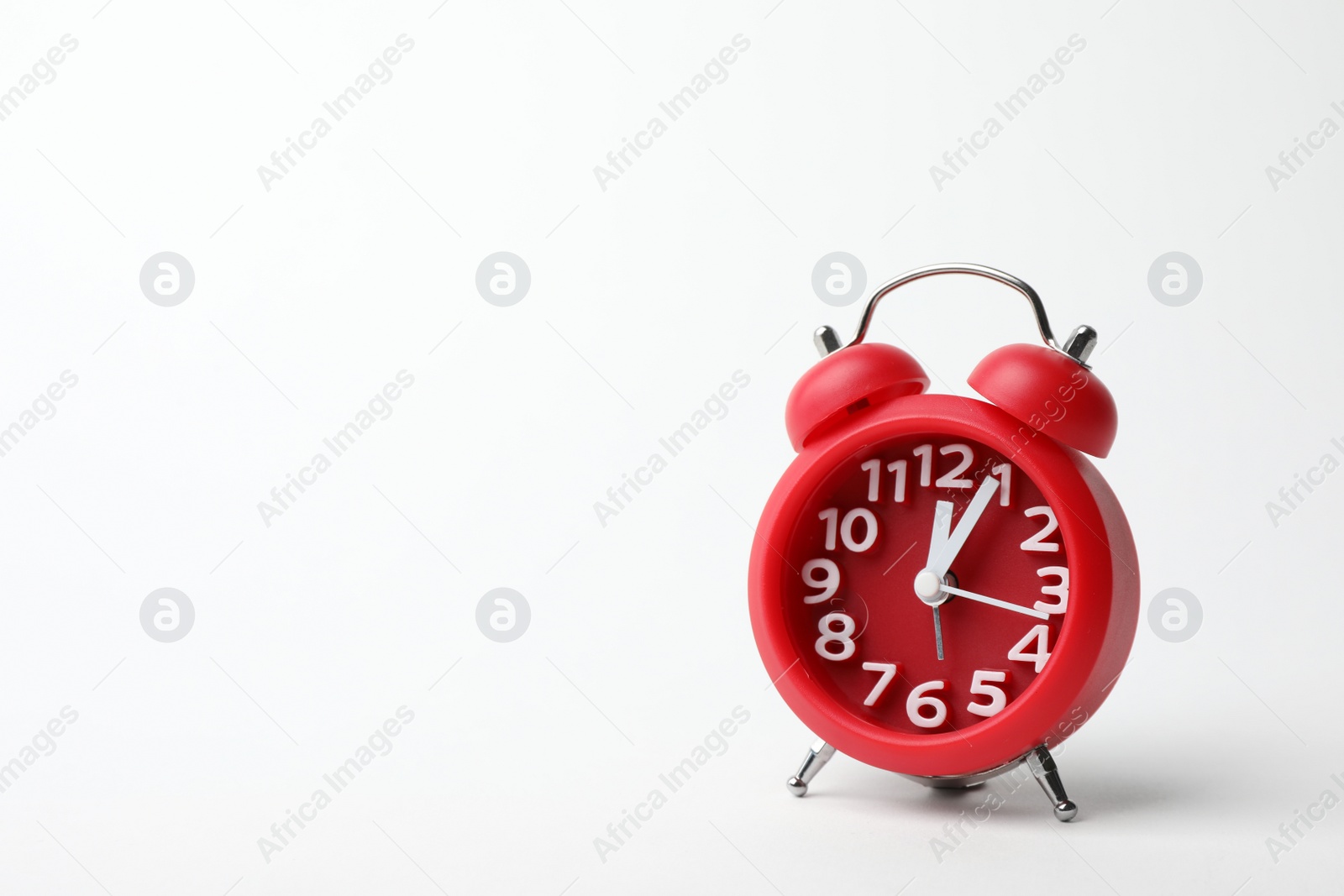 Photo of Alarm clock on white background. Time concept