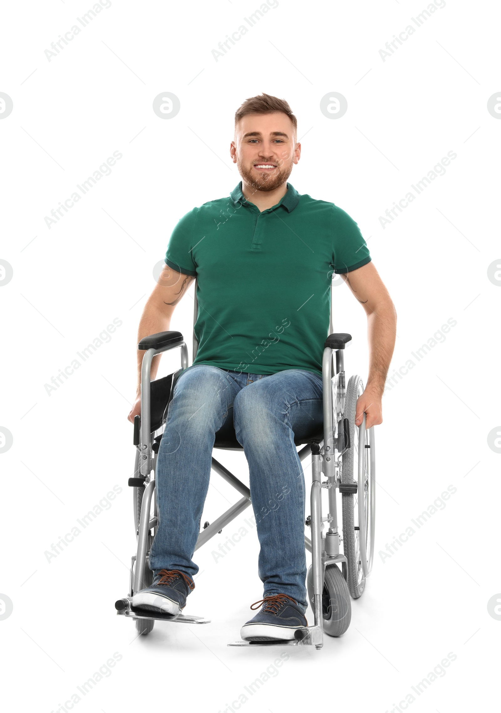 Photo of Handsome young man in wheelchair isolated on white