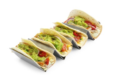 Delicious tacos with guacamole, meat and vegetables isolated on white