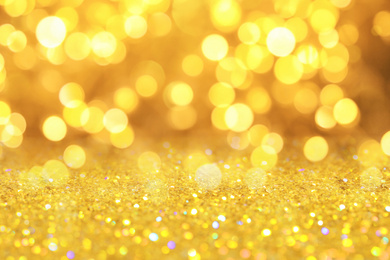 Gold glitter with bokeh effect as abstract background