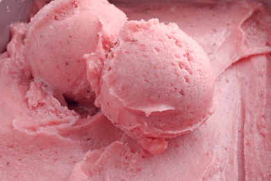 Photo of Scoops of delicious strawberry ice cream, closeup